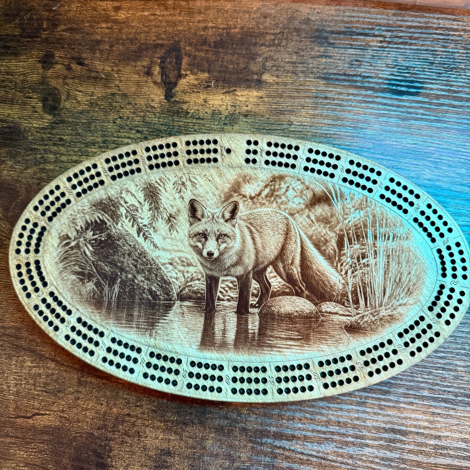 Detailed engraved cribbage board